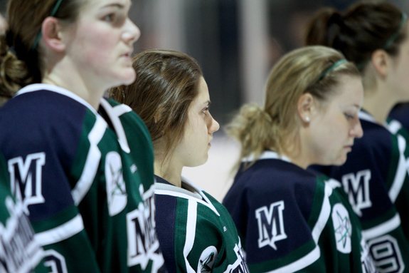 Ethan Magoc photo: Mercyhurst College senior Vicki Bendus stands at the blue line with her teammates during the national anthem on Saturday, Feb. 5, 2011, at the Mercyhurst Ice Center.